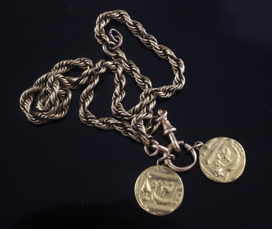 A gold ropetwist chain hung with two high carat gold Middle Eastern coins.